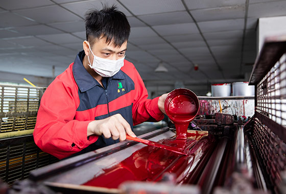 a-worker-pouring-pigment-to-the-machine