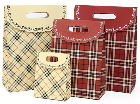 Lattice style die cut gift bag with lid