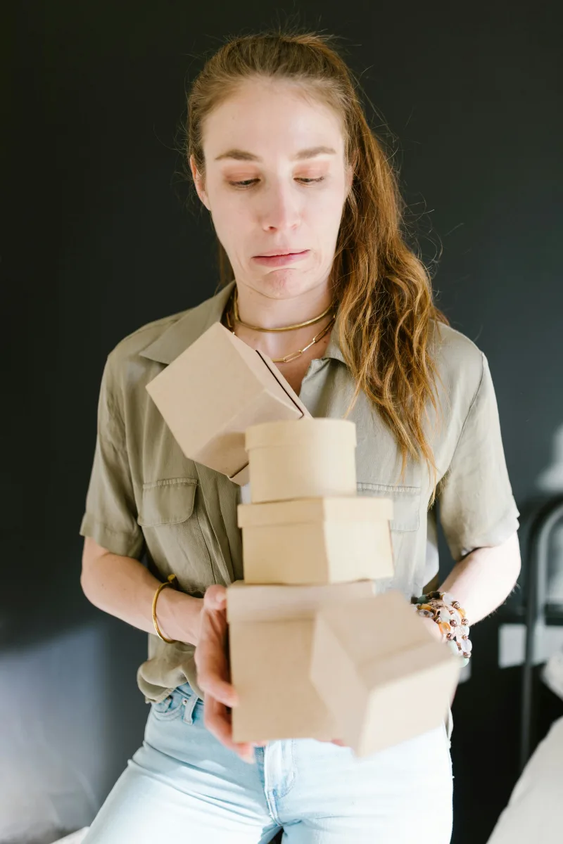 frustrated customer opening bulky plastic packaging safely