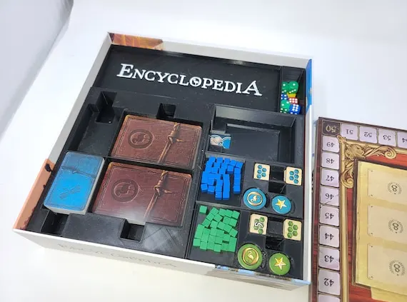 board game box internal layout with protective inserts
