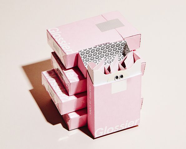 Glossier minimalist pink skincare packaging design