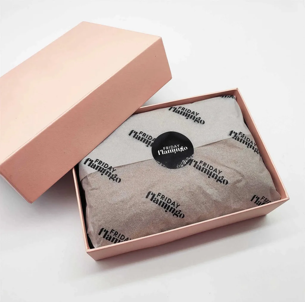 luxury unboxing with branded tissue paper and handwritten note