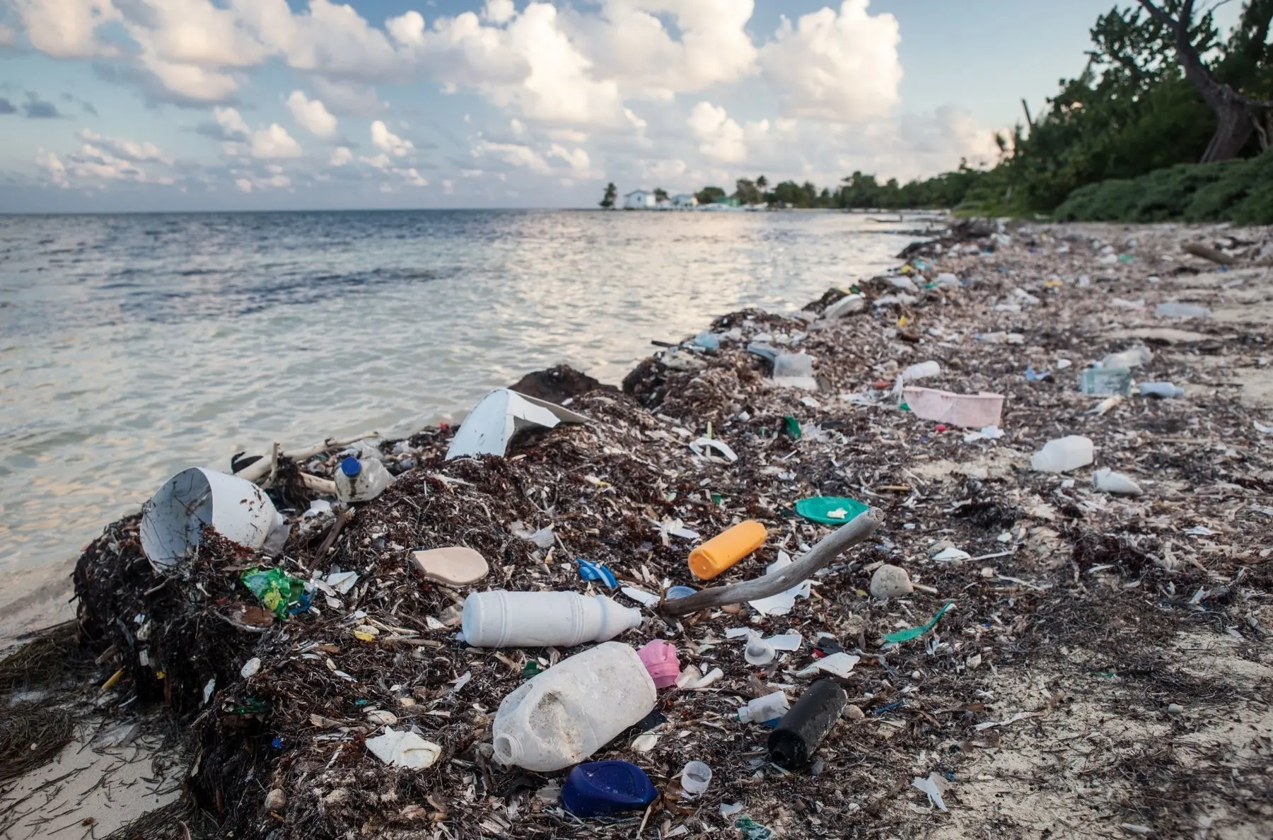 mountain of single use plastic waste polluting landfill and ocean
