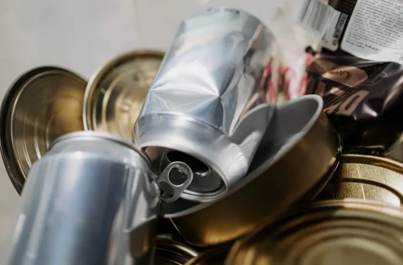 aluminium cans being recycled, metal packaging, environmental sustainability