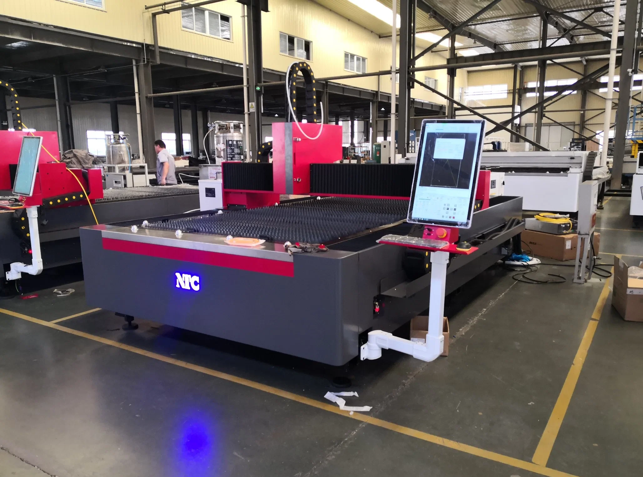 precision laser cutting machinery operating in an industrial factory