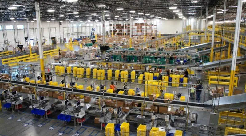 robotic arms automate paper packaging in modern factory