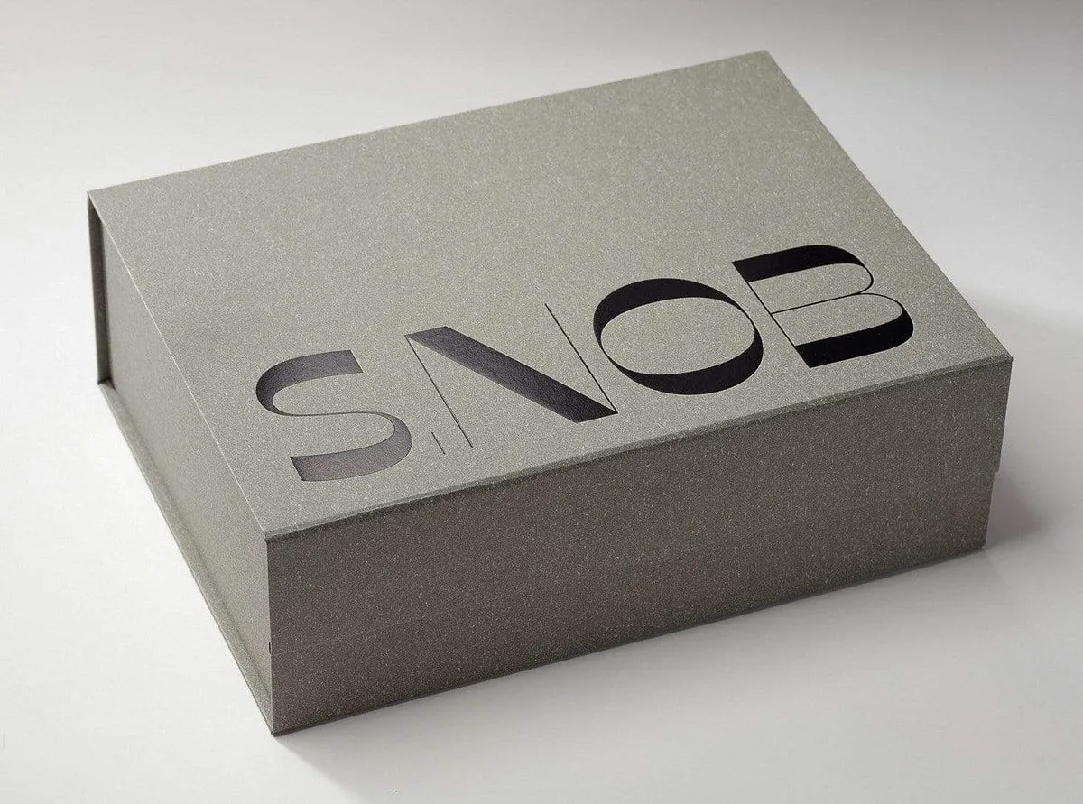 variety of greyboard packaging materials with luxury and rustic finishes