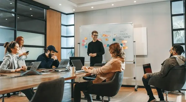 creative team collaborating in business meeting, innovation strategy, teamwork for brand consistency